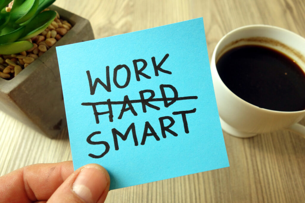 Work smart text – motivational reminder handwritten on sticky note